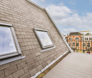 Bright balcony with door Bright brick balcony with metal railings and door