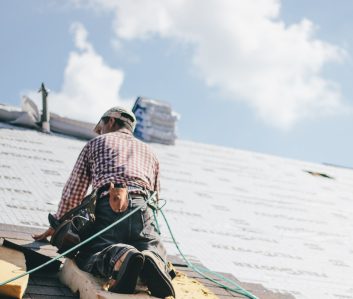 roofer-adding-shingles-to-the-roof-of-a-house.jpg