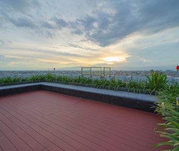 Sky garden on private rooftop of condominium or hotel, high rise architecture building with tree, grass field, and blue sky. Sky garden on private rooftop of condominium or hotel, high rise architecture building with tree, grass field, and blue sky.